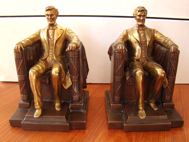 A pair of "Lincoln in the chair" bookends by Jennings Brothers circa 1930